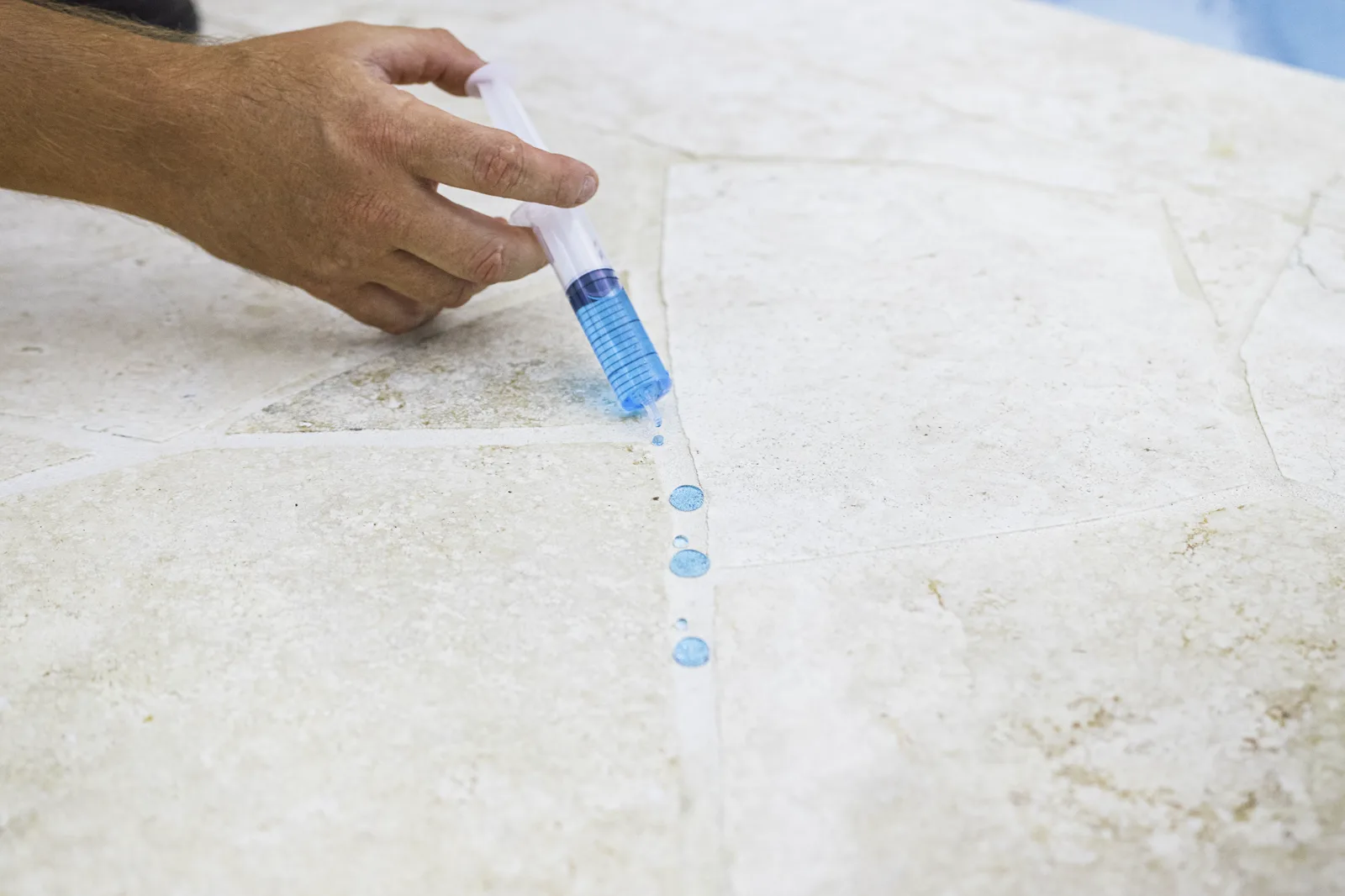 Water beading on a sealed stone surface