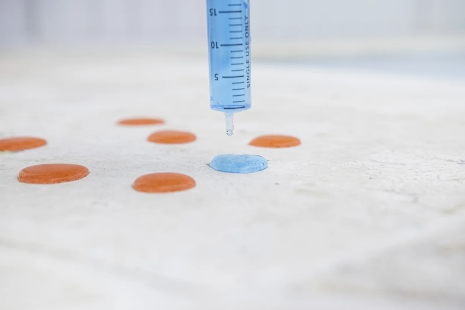 Water beading on a sealed mineral benchtop surface