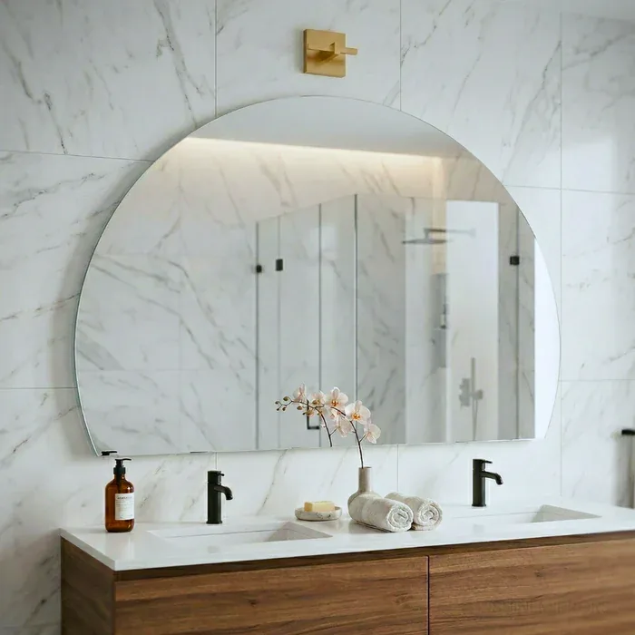 A framed bathroom mirror