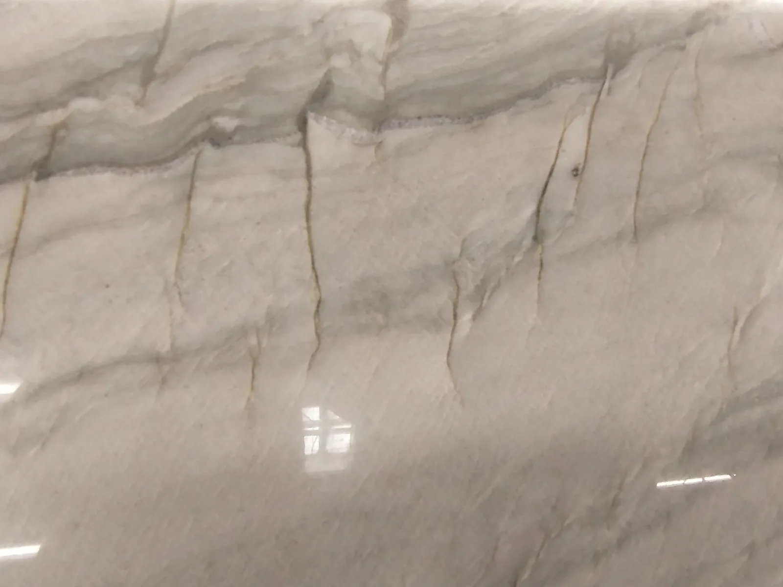 Polished quartzite slab with veining